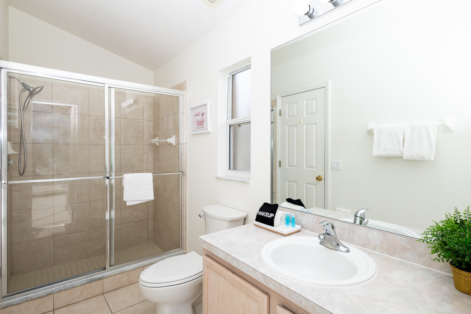 Ensuite bathroom with patio access, and stand-up shower