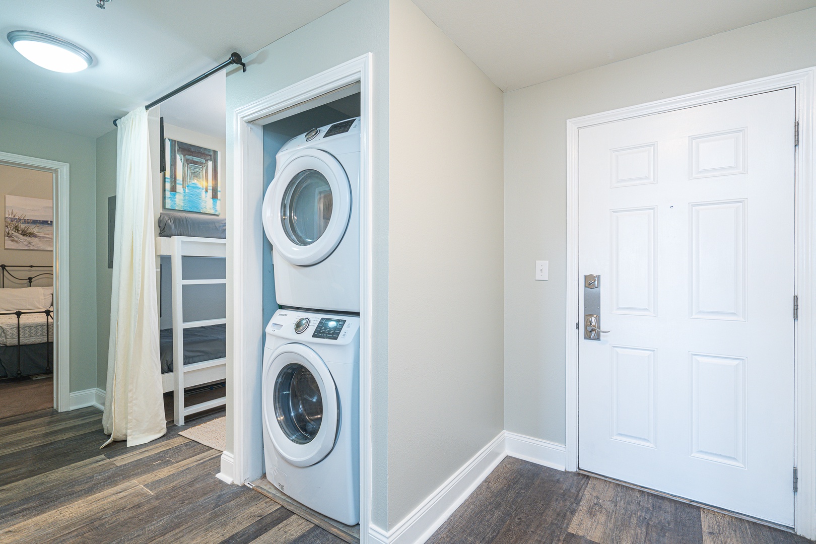 The entryway offers laundry & a snug sleeping nook for a warm welcome