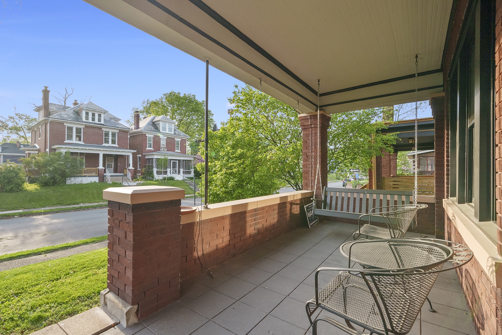 Sip morning coffee or an evening cocktail on the serene front porch