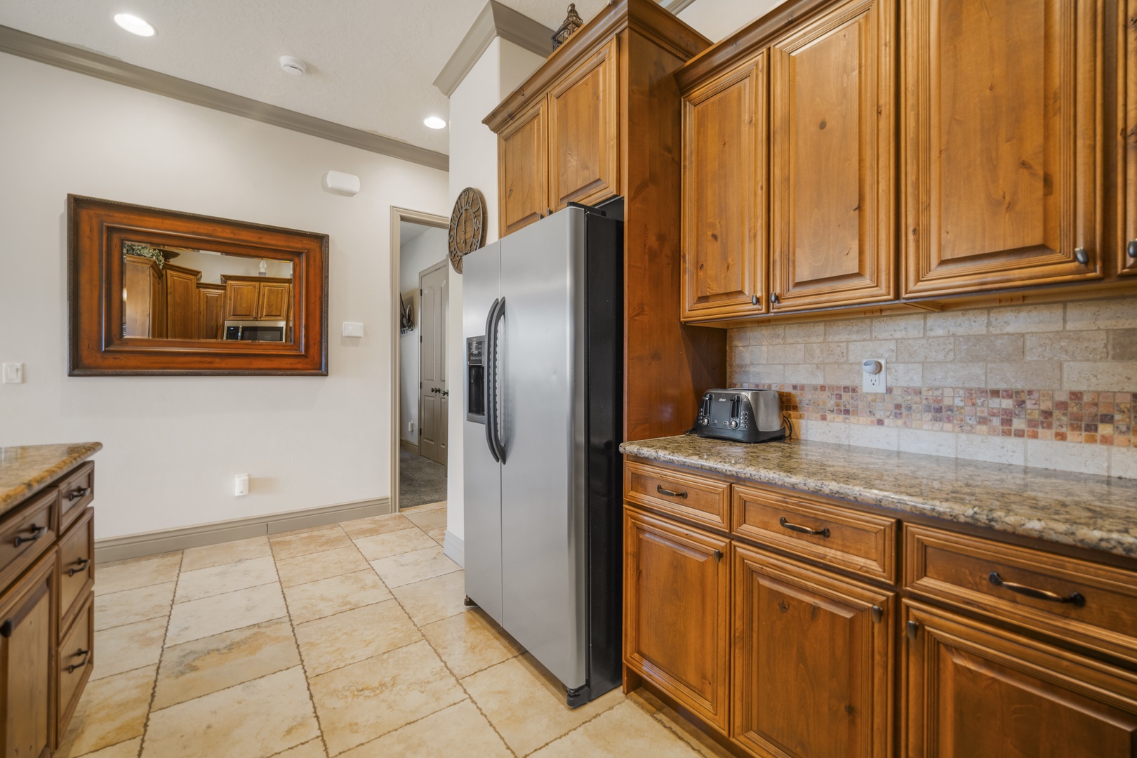 The warm, open kitchen offers ample space & every home comfort