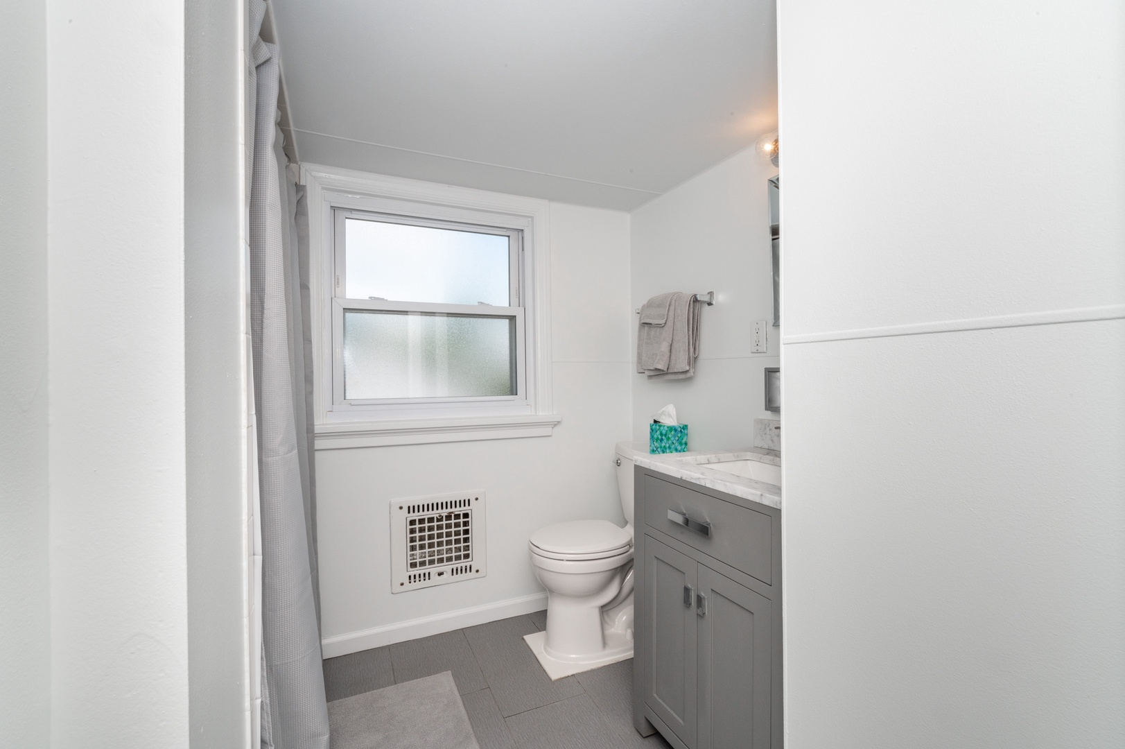 A full bath on the 3rd level offers a single vanity & walk-in shower