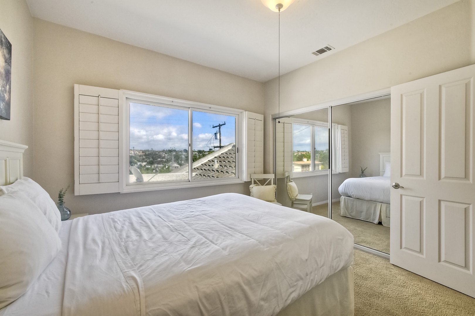 The tranquil 3rd floor bedroom offers a comfy queen bed