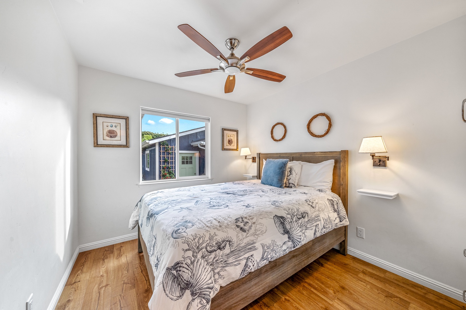 The 1st of 2 bedrooms offers a comfy queen bed & ceiling fan