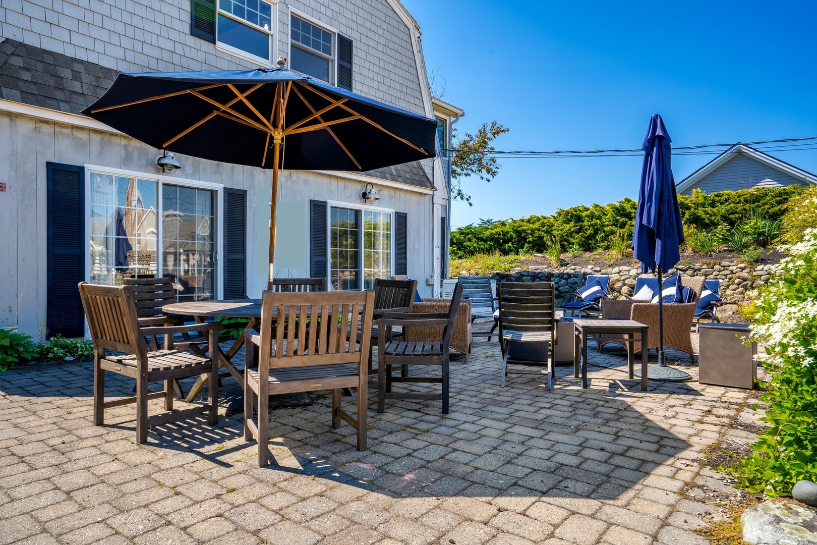 Inviting front patio with cozy fire pit for relaxation