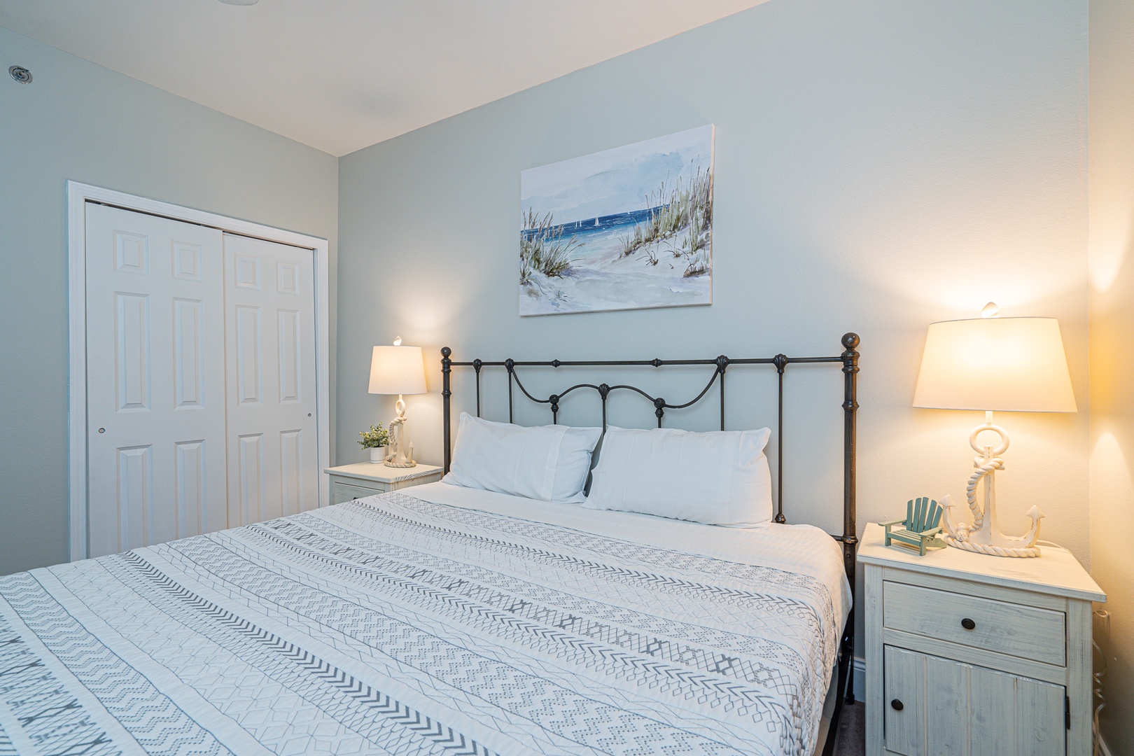 The final private bedroom showcases a king-sized bed & Smart TV
