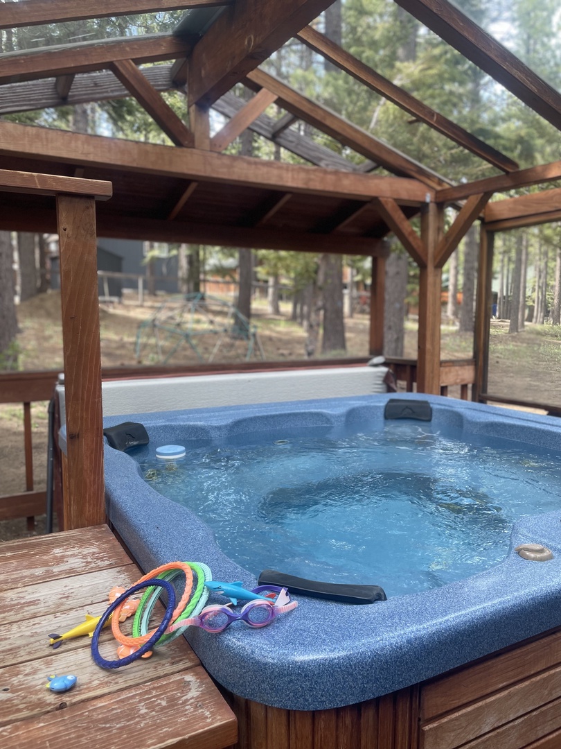 Covered, private hot tub with string lights!