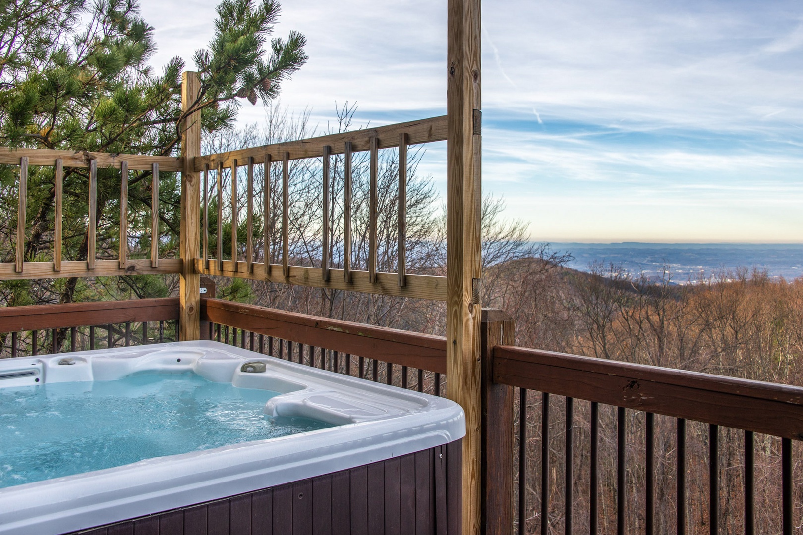 Soak all your cares away with stunning views on the back deck