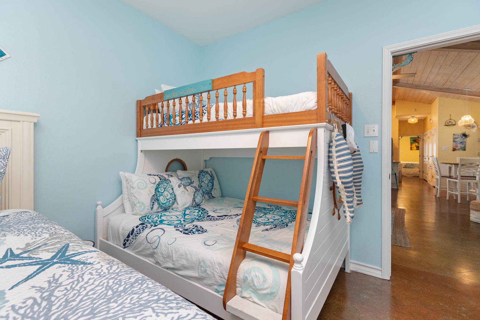 Bedroom 2 with Queen bed, Twin/Full bunk bed, Smart TV, patio access, and en-suite