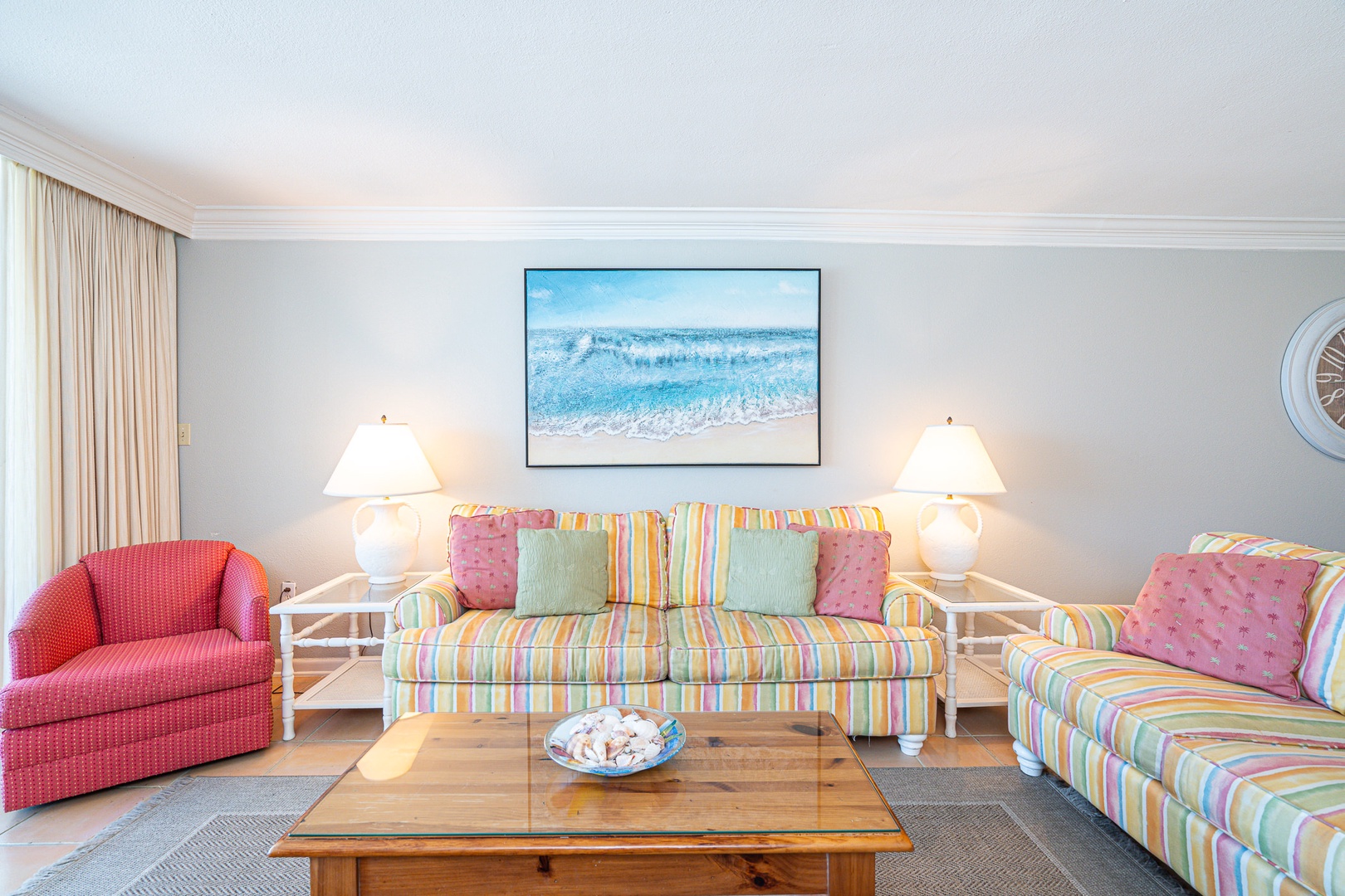 Living room with sofa sleeper, Smart TV, and balcony