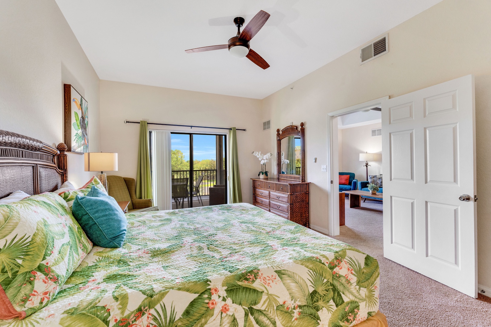 Bedroom 3 with king bed, TV, balcony, and ensuite