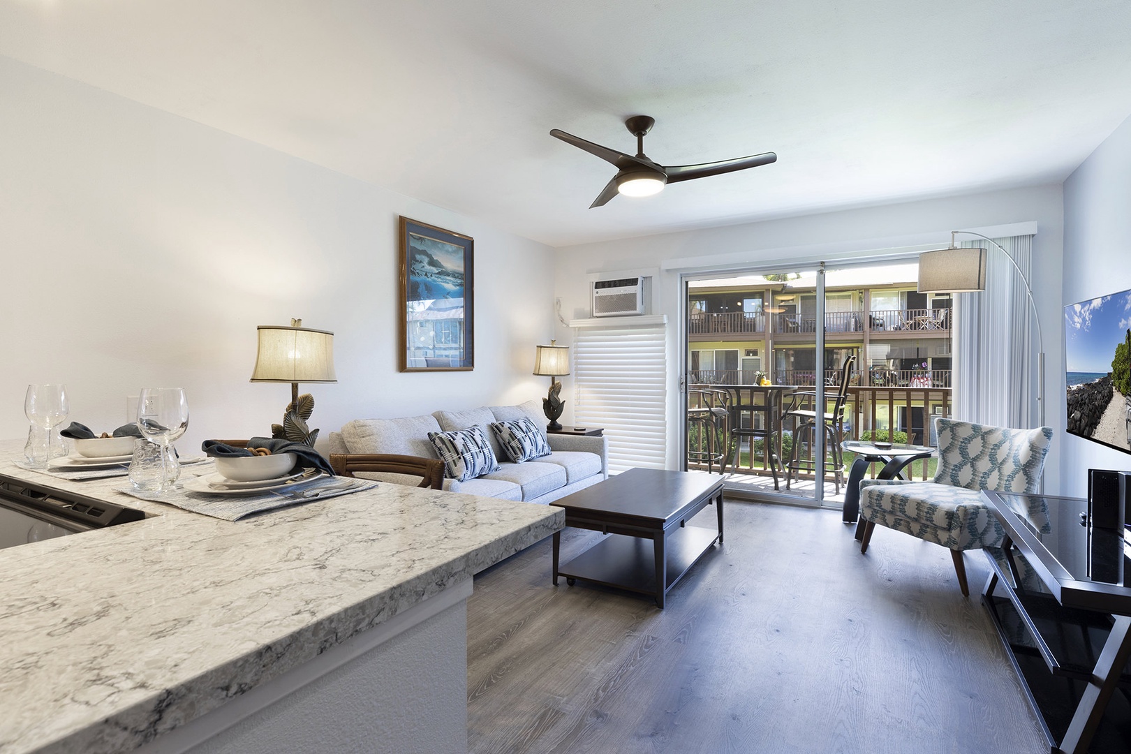 Open living space with TV, and sofa sleeper