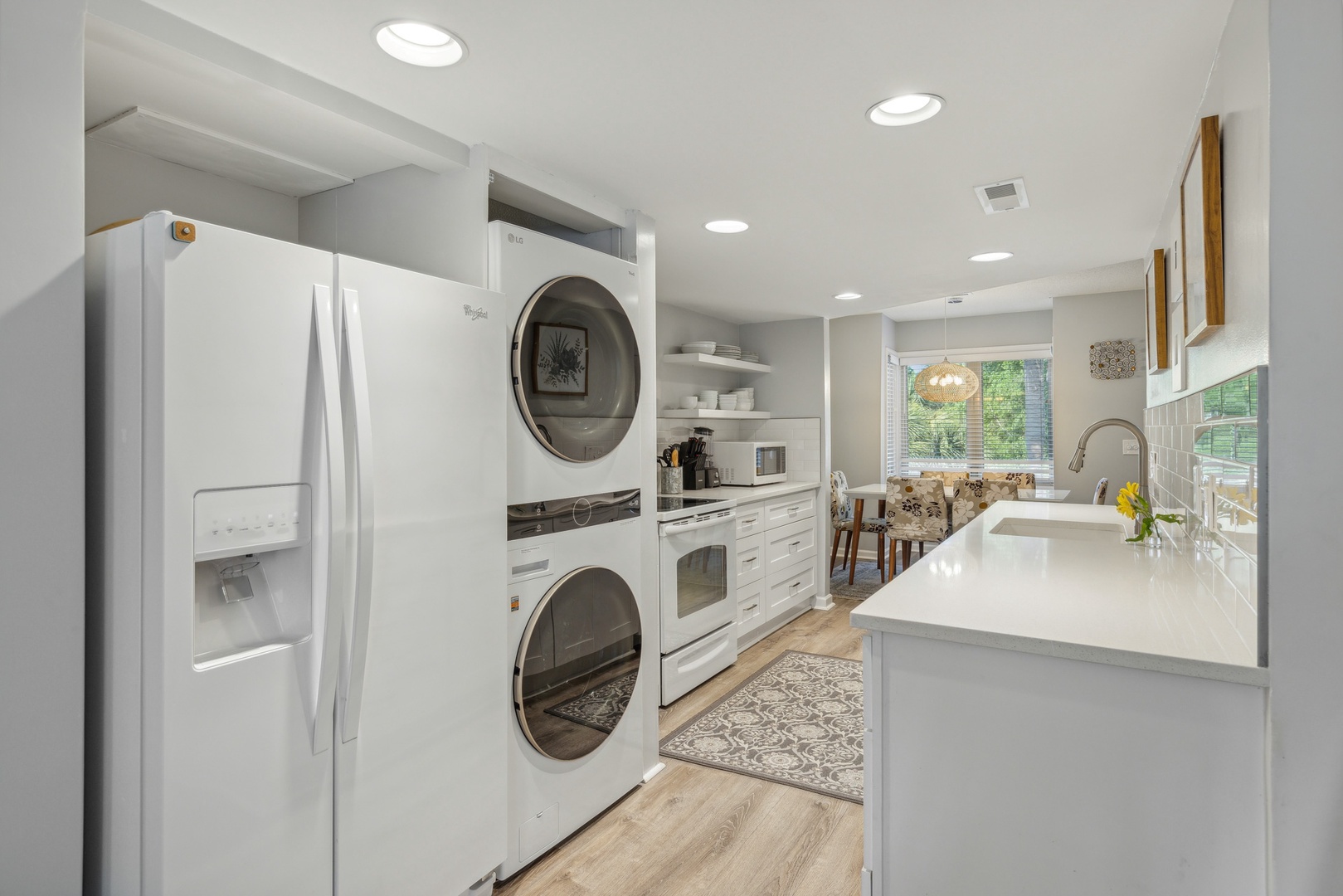 This open, modern kitchen has ample space & all the comforts of home