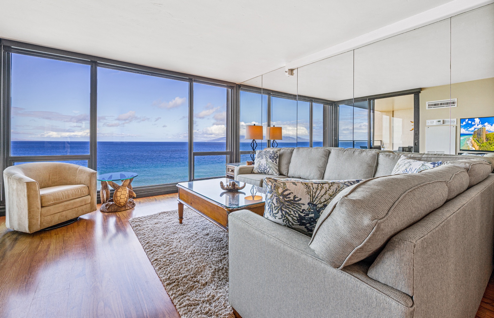 Living space with panoramic ocean views, sofa sleeper, and Smart TV