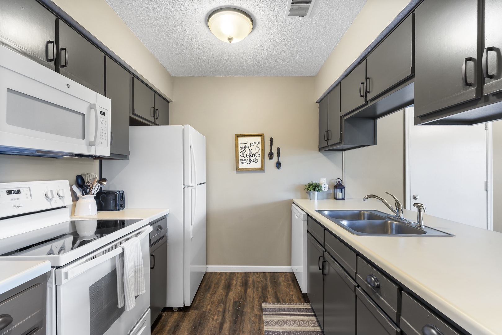 Unit 20’s breezy kitchen showcases ample space & every home comfort