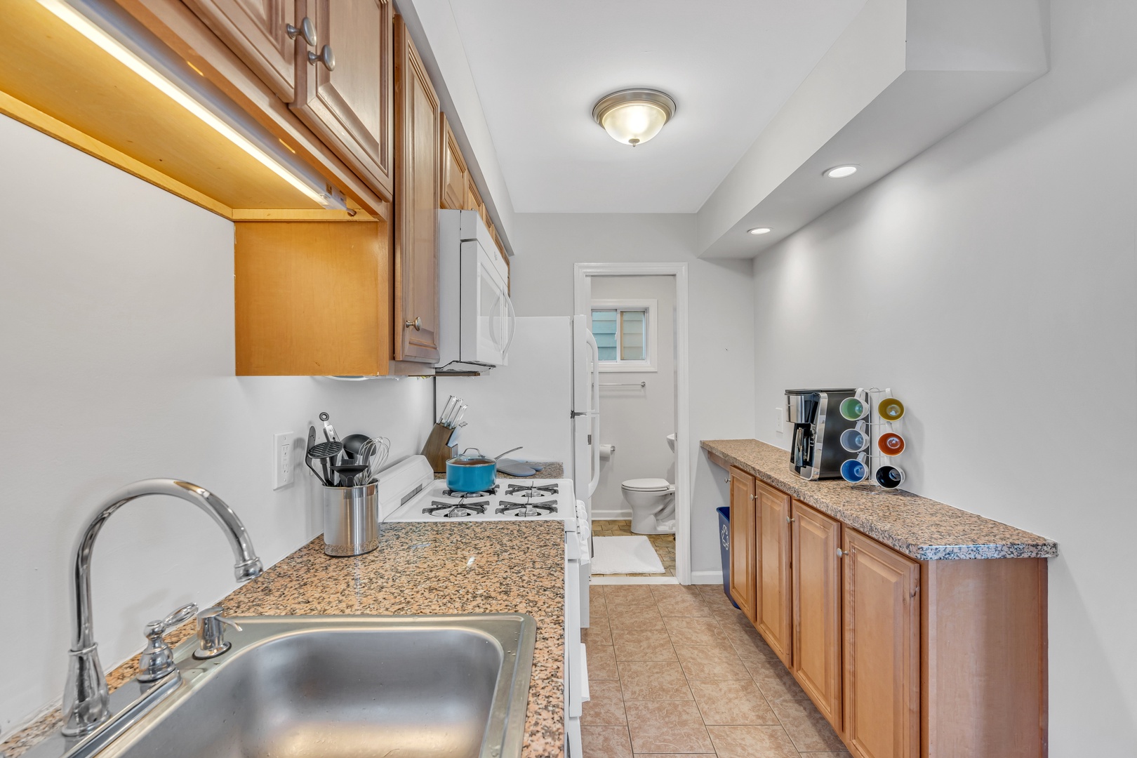 The airy eat-in kitchen offers ample space & all the comforts of home