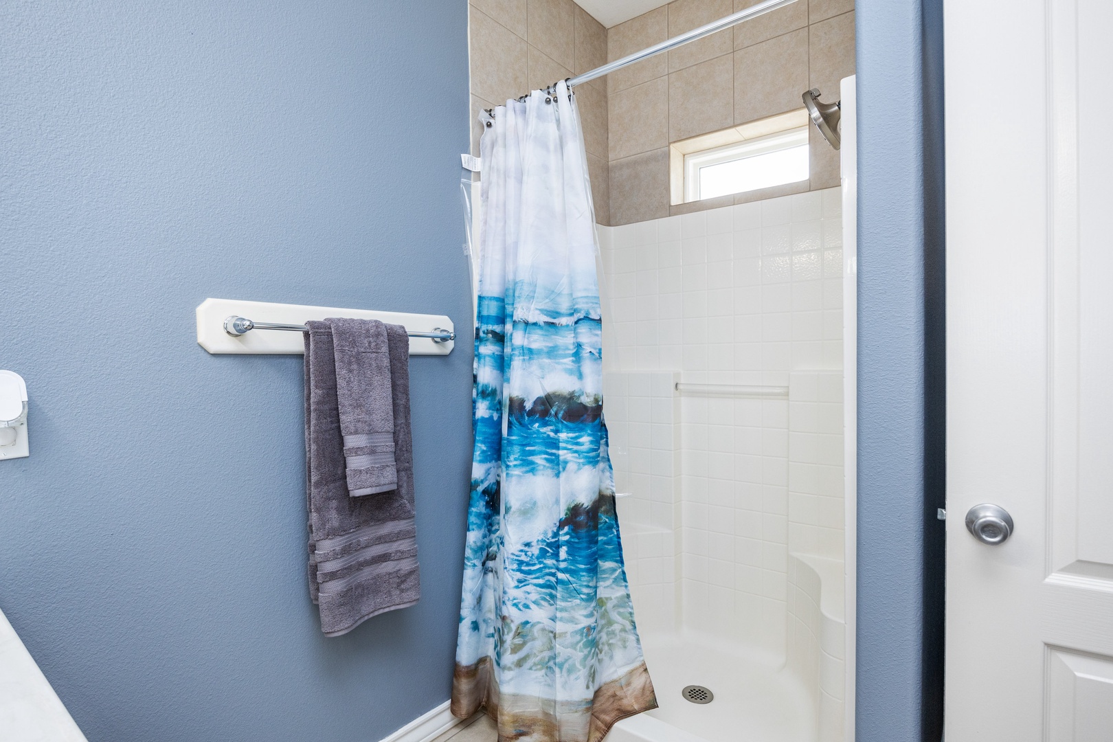 The downstairs bathroom includes a single vanity & walk-in shower