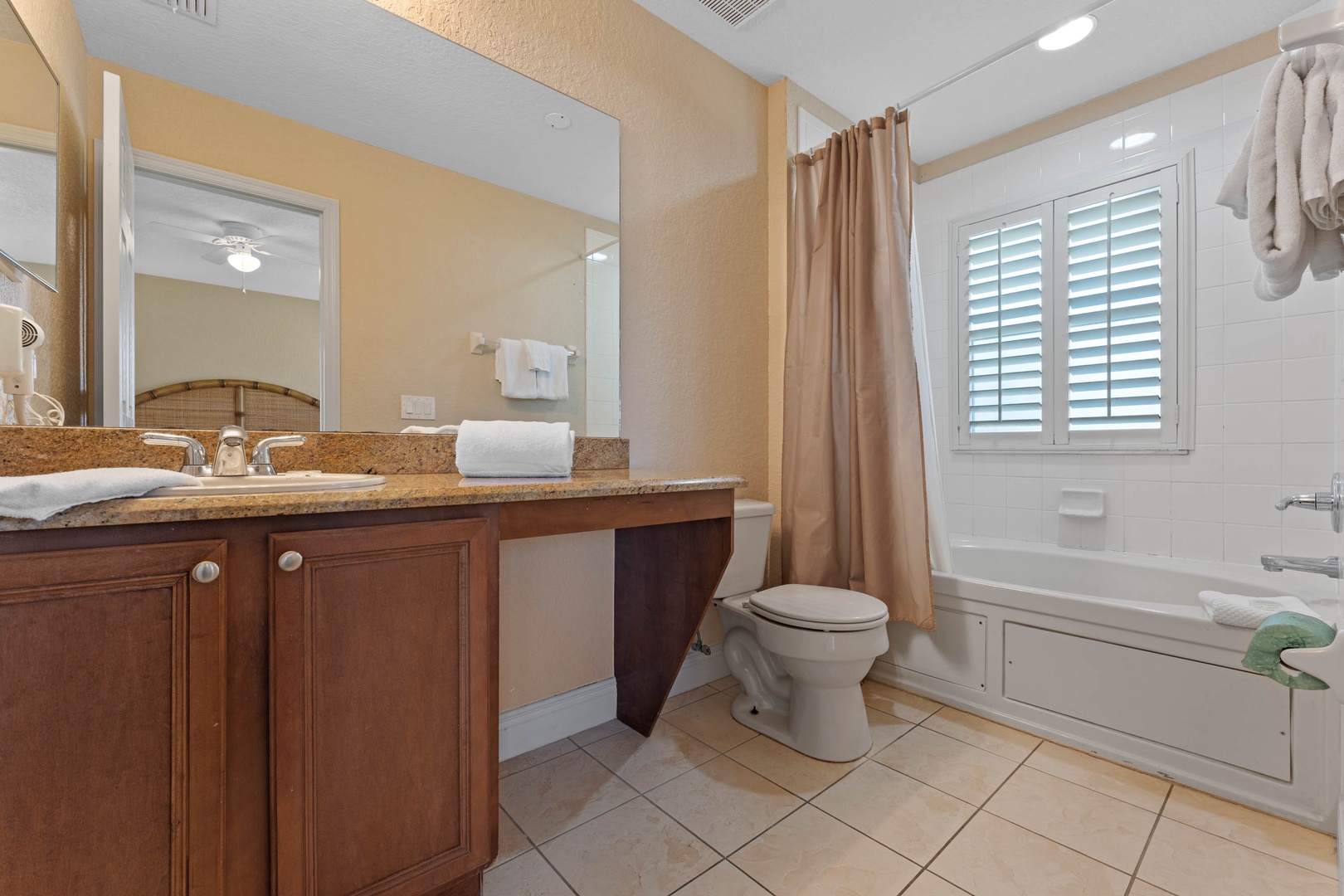 The 2nd floor ensuite bath offers a large vanity & shower/soaking tub combo