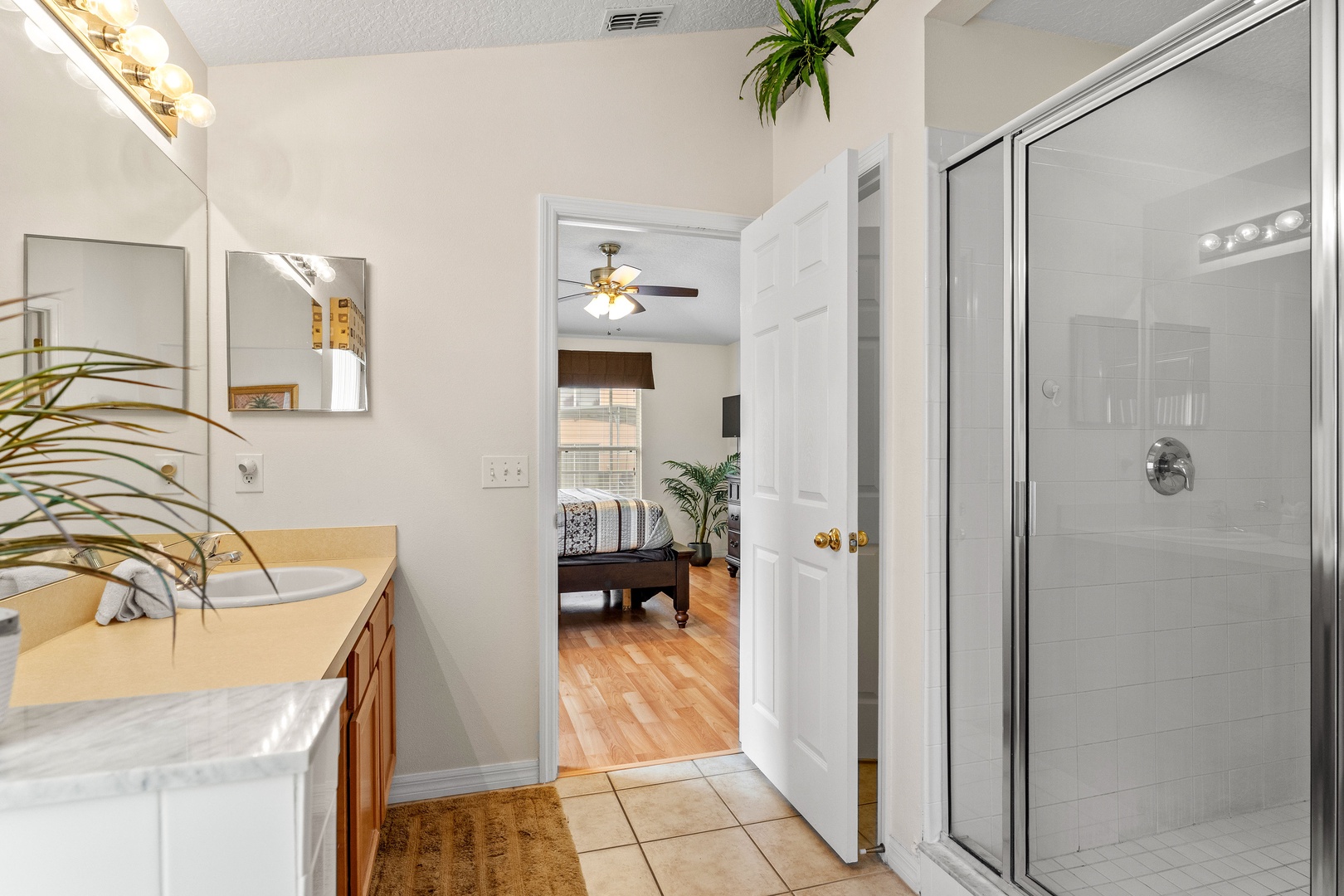 Private ensuite bath with oversized single vanity, soaking tub & separate shower
