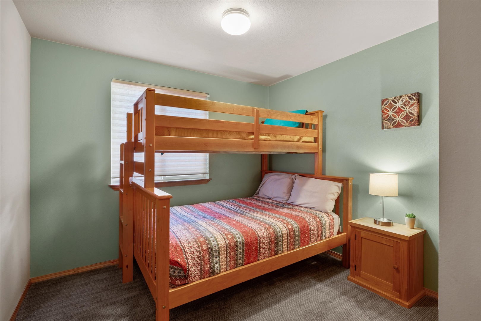 The first of two tranquil twin-over-full bunkbed bedroom retreats