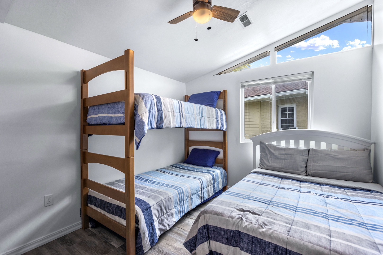 The first main-level bedroom offers a full bed & cozy twin-over-twin bunk bed