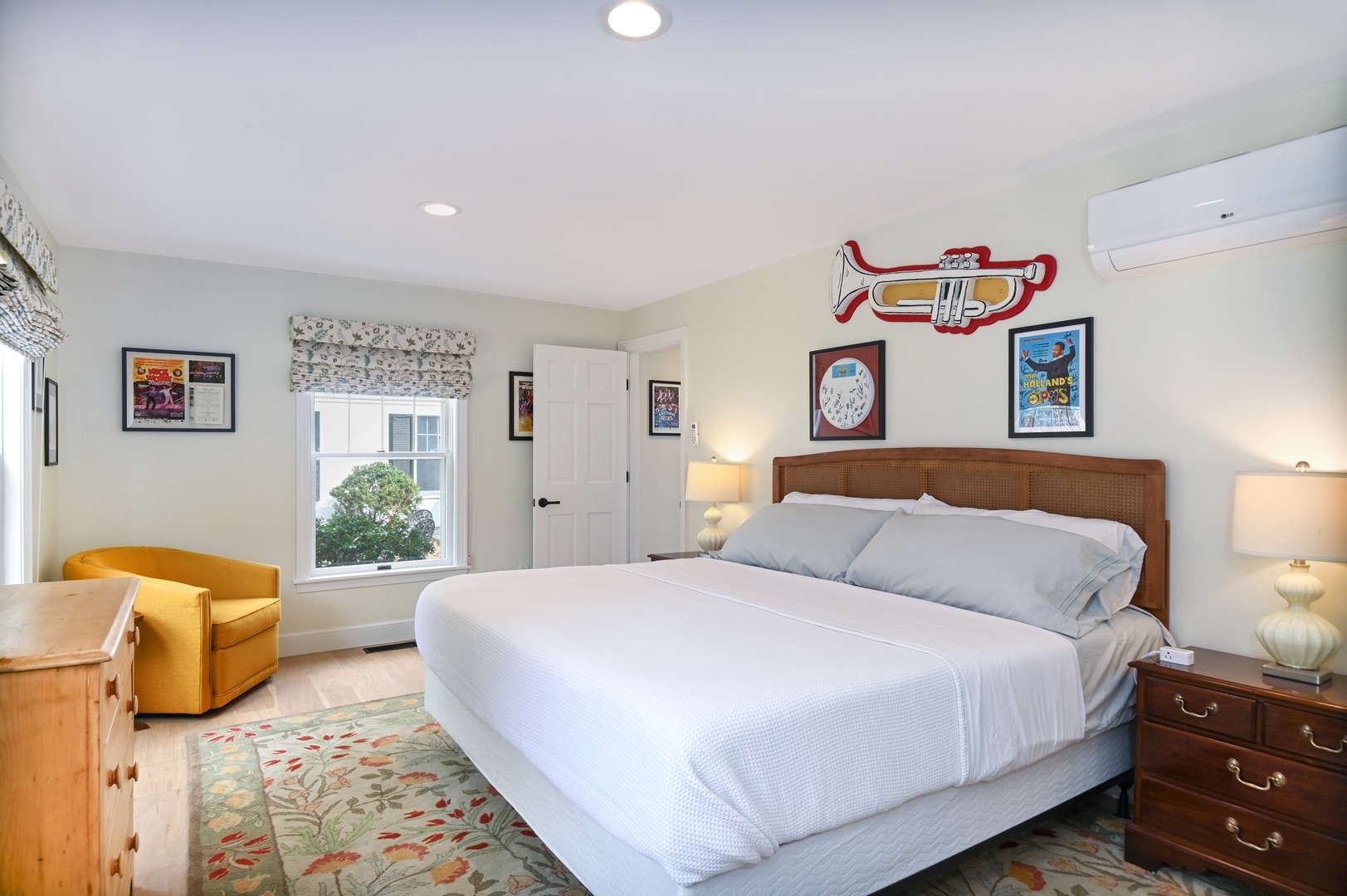 Playhouse’s chic king bedroom features a Smart TV & fantastic theater artwork