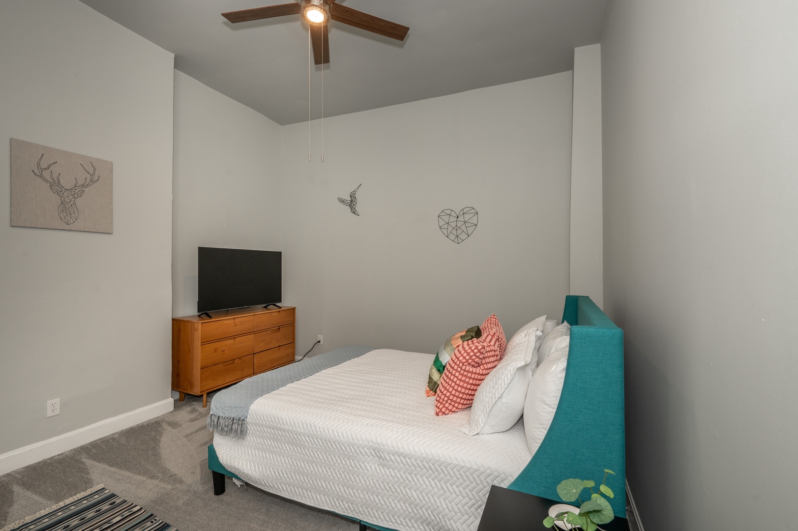 Unit 2: The 2nd of 2 queen bedrooms offers a Smart TV & ceiling fan