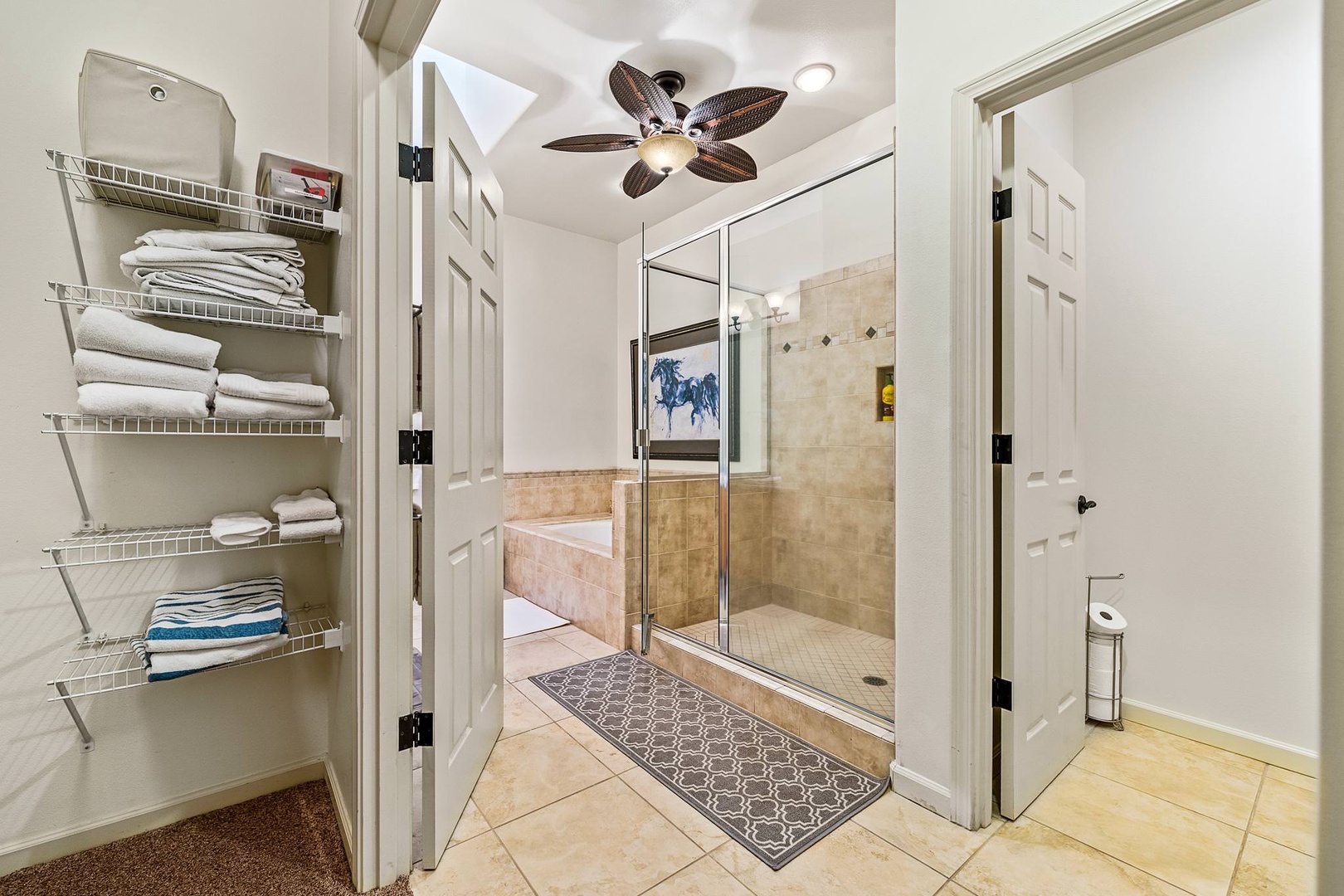 En suite master bathroom with dual sinks, soaking tub and standing shower