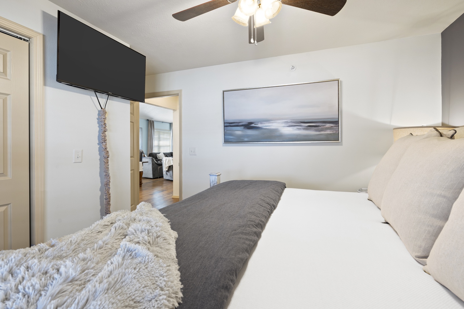 The first chic bedroom retreat boasts a plush king bed & Smart TV