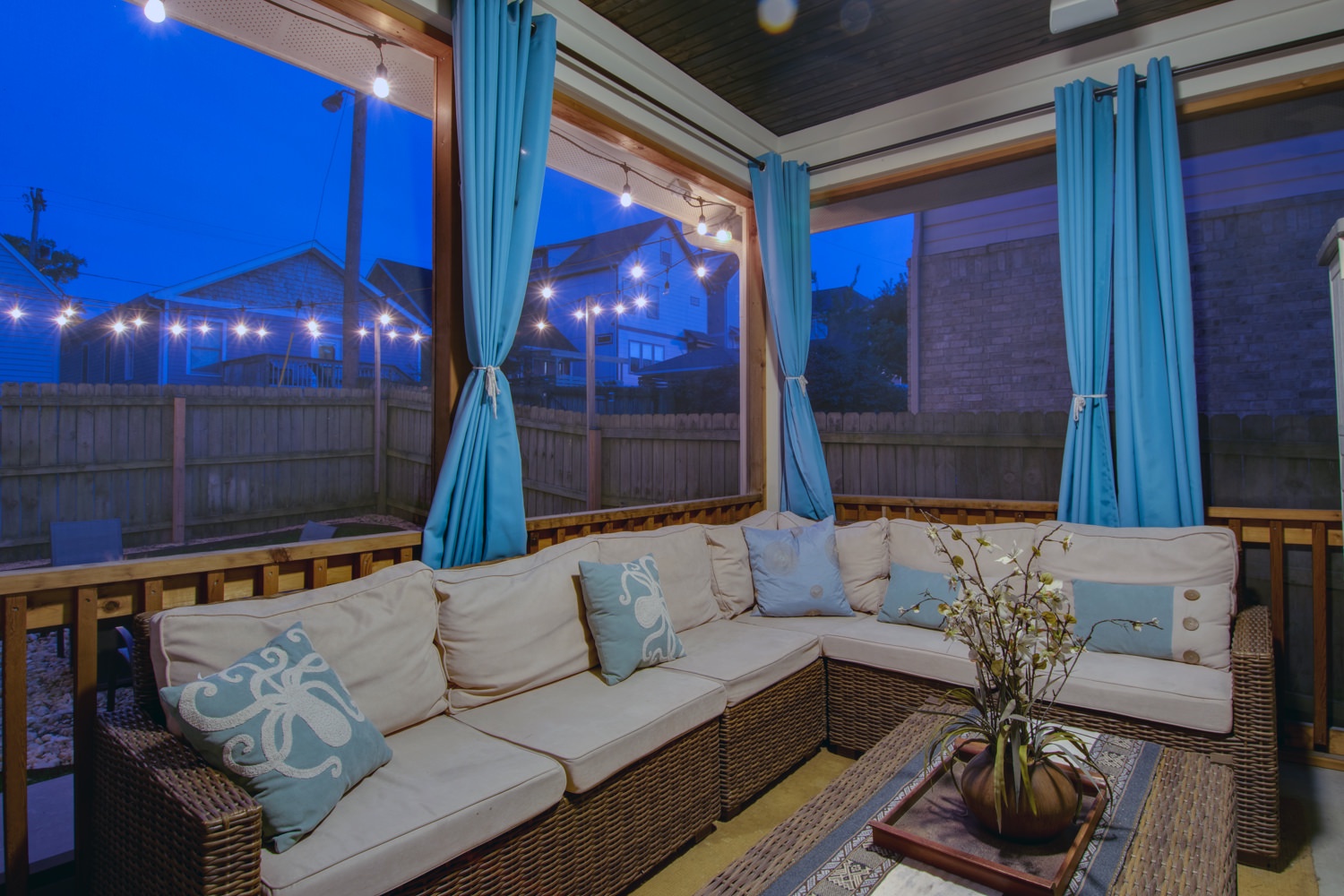 Backyard covered patio seating at night