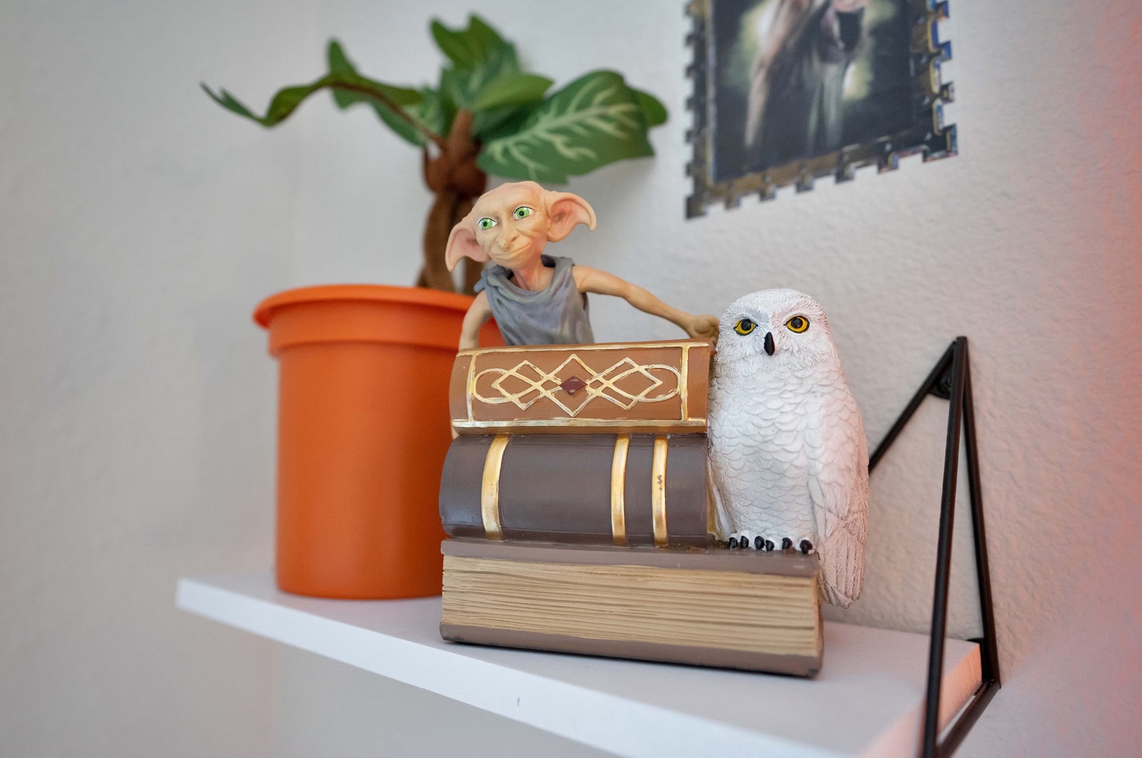 Cozy queen bed with Harry Potter magic, overhead fan, and a comfy chair