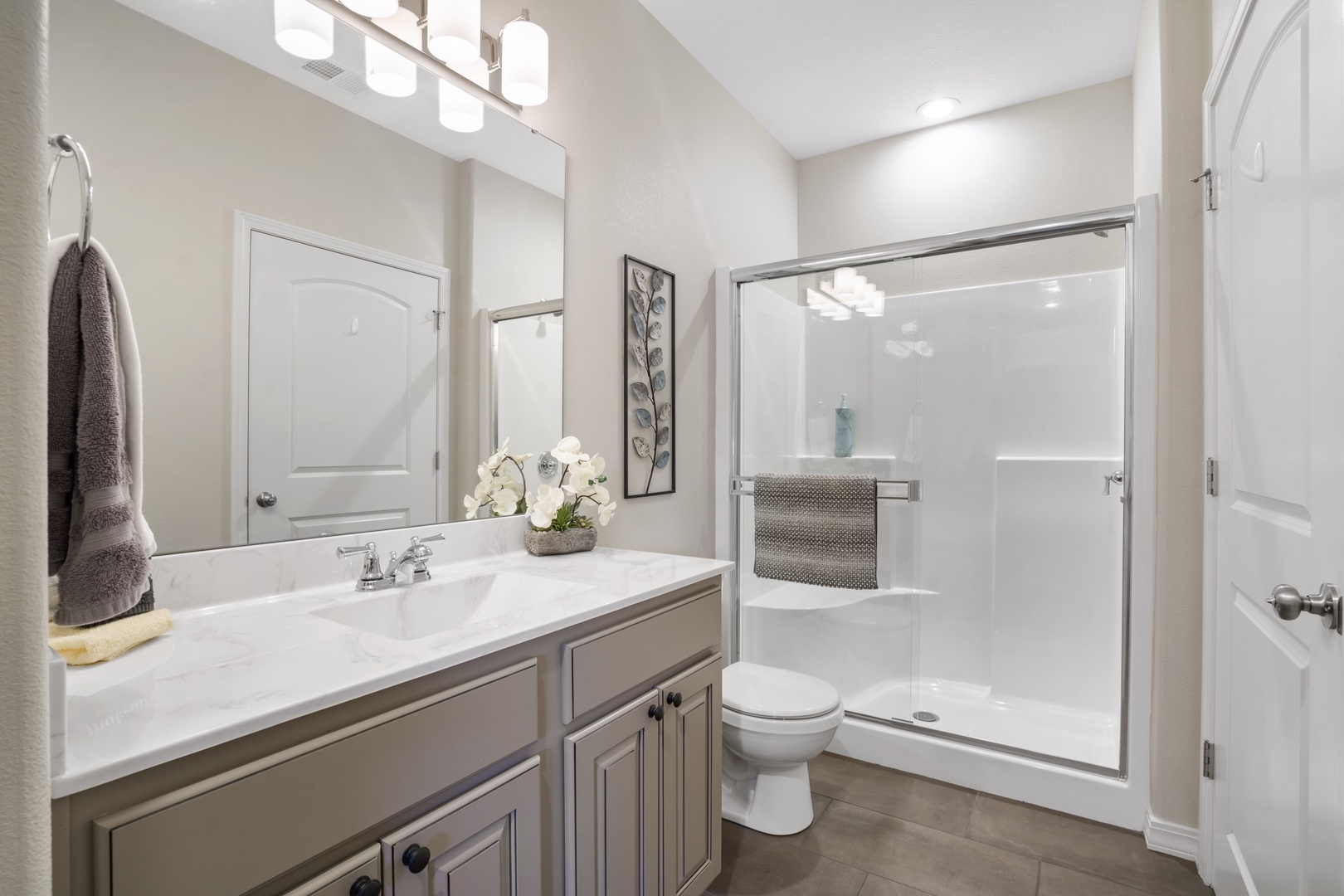 Bathroom 1 share en-suite with walk-in shower accessible from living area, and bedroom 1