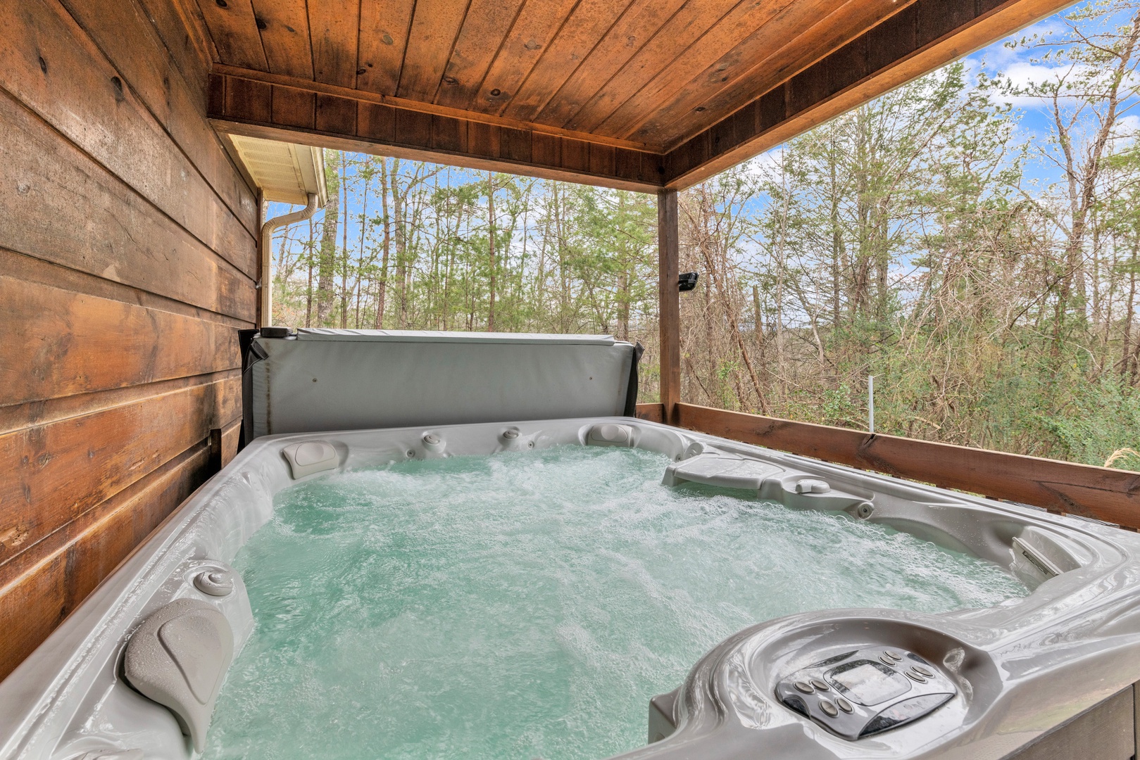 Soak your cares away with tranquil nature views in the private hot tub