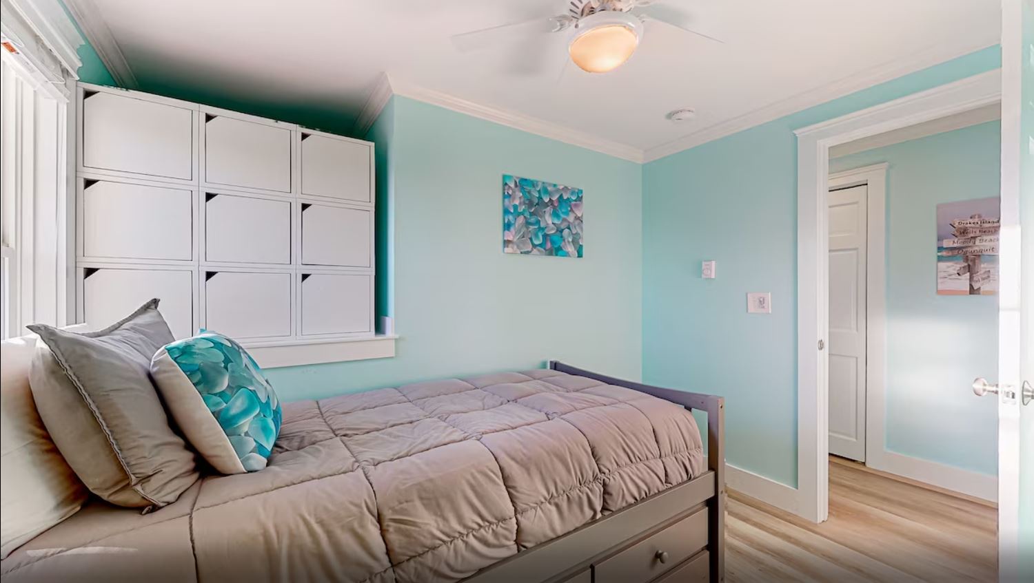 The beachy 2nd floor twin bedroom includes & Smart TV & ceiling fan