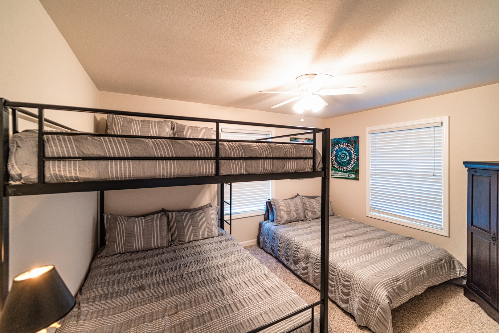 The final bedroom includes queen-over-queen bunks & a standalone queen