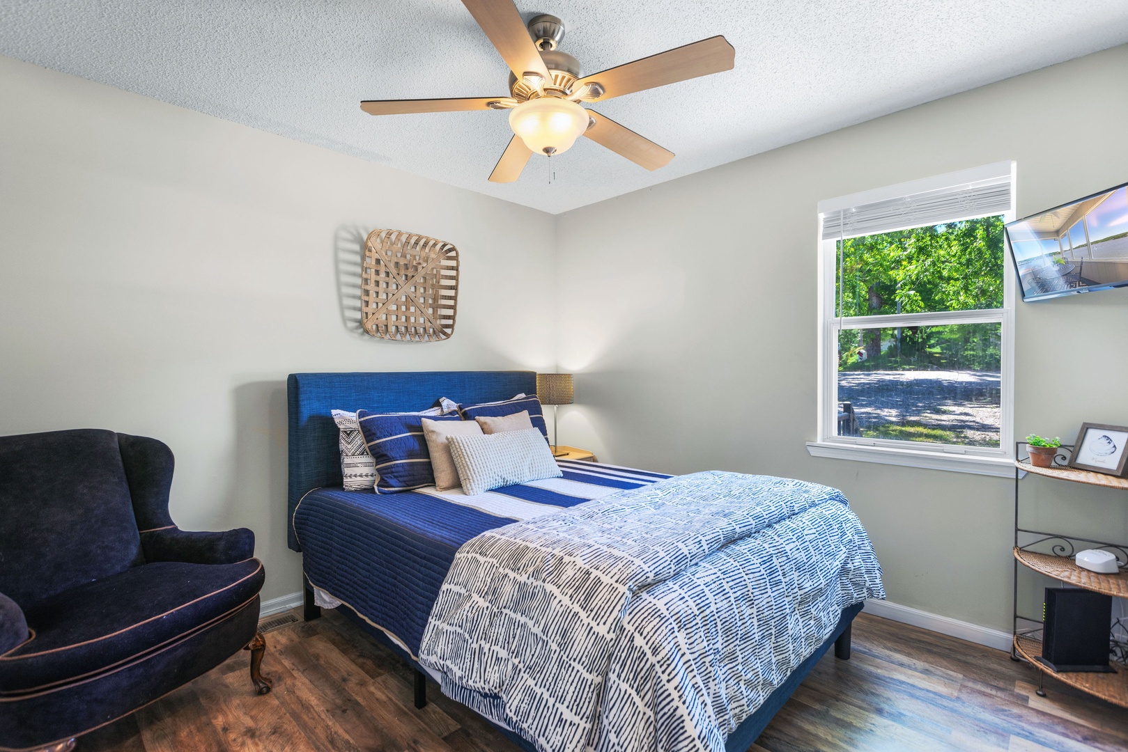 The second bedroom on the main floor offers a regal queen bed & Smart TV