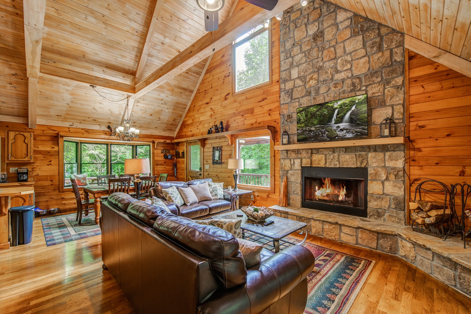 Curl up to enjoy a movie by the fireplace in the cozy, spacious living area