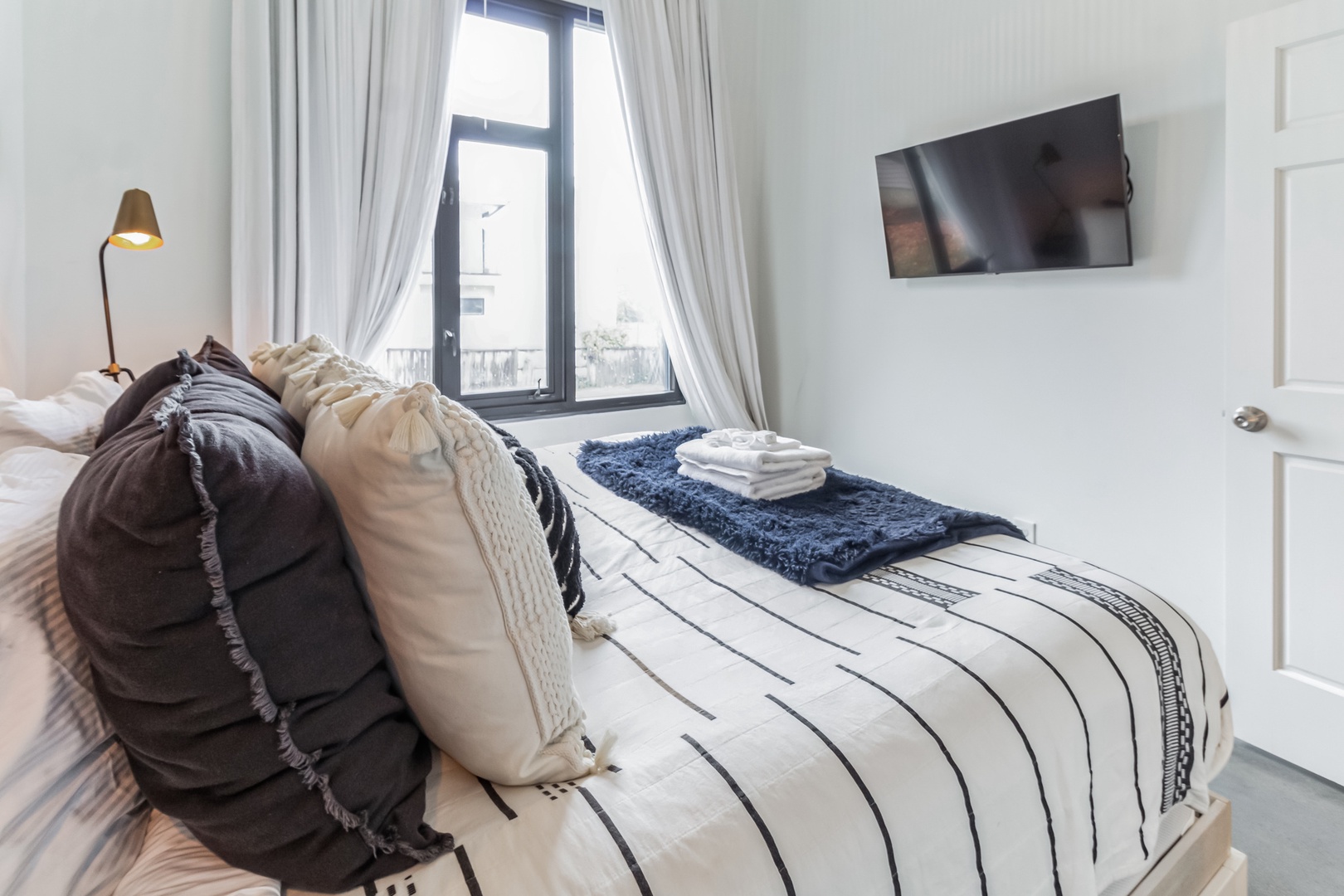 Unit C1: The private bedroom offers a luxurious king-sized bed & Smart TV
