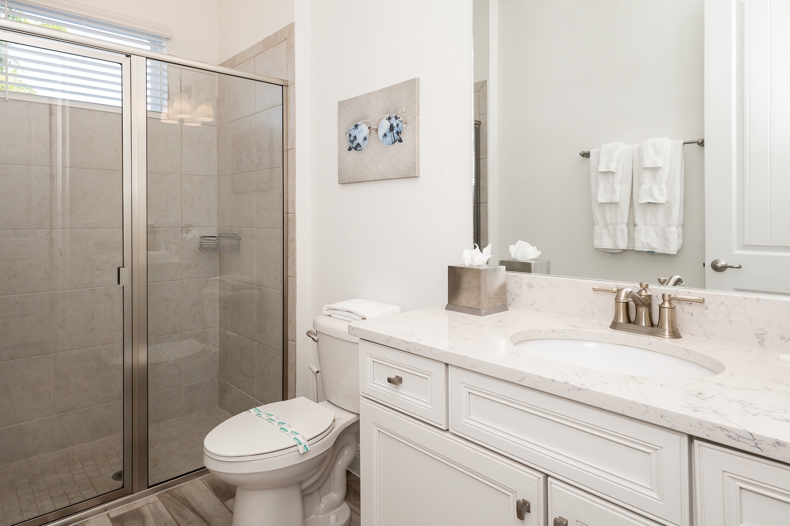 The 1st floor king en suite offers a beautiful single vanity & glass shower