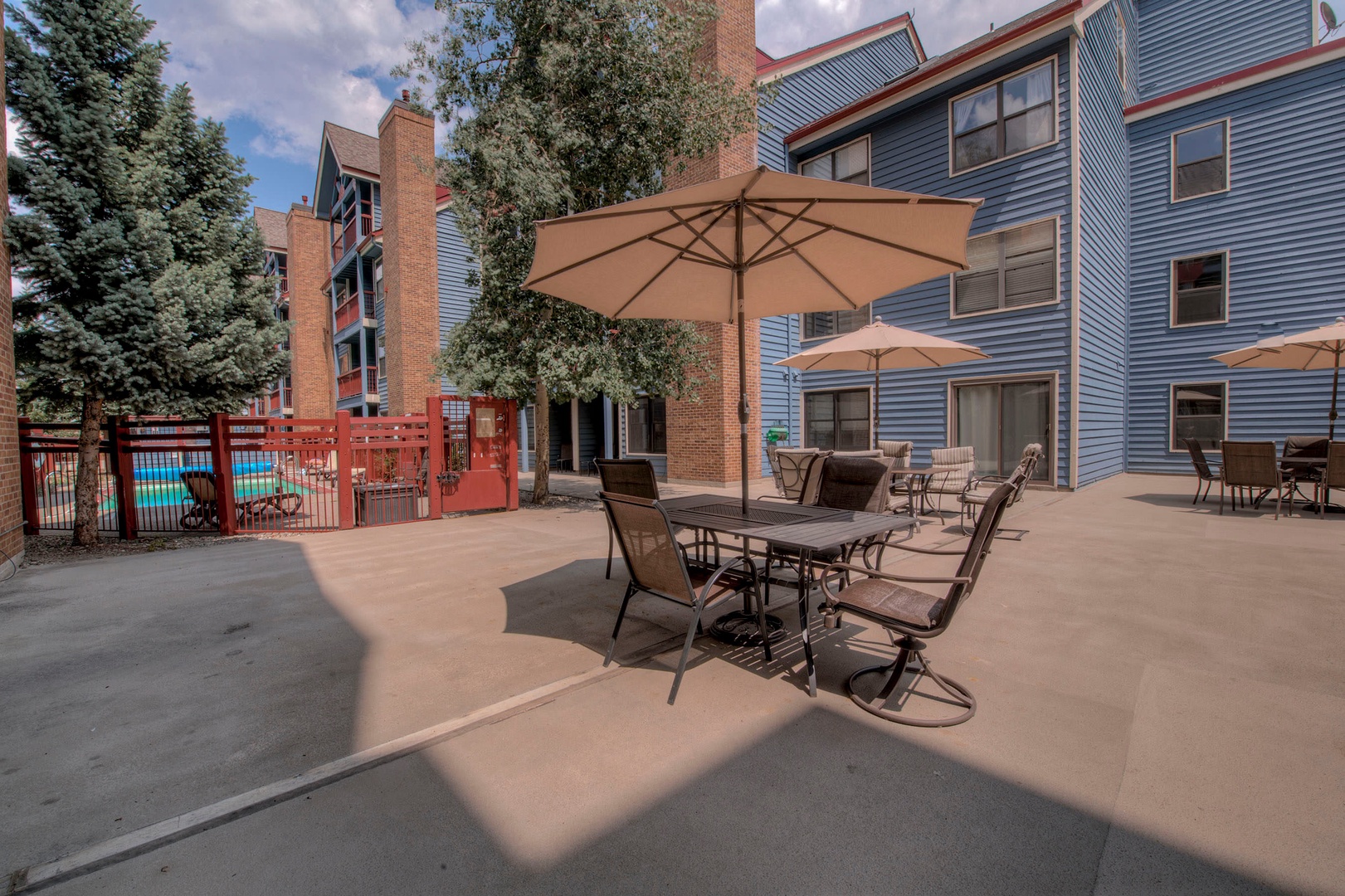Shared condo complex patio seating and BBQ area