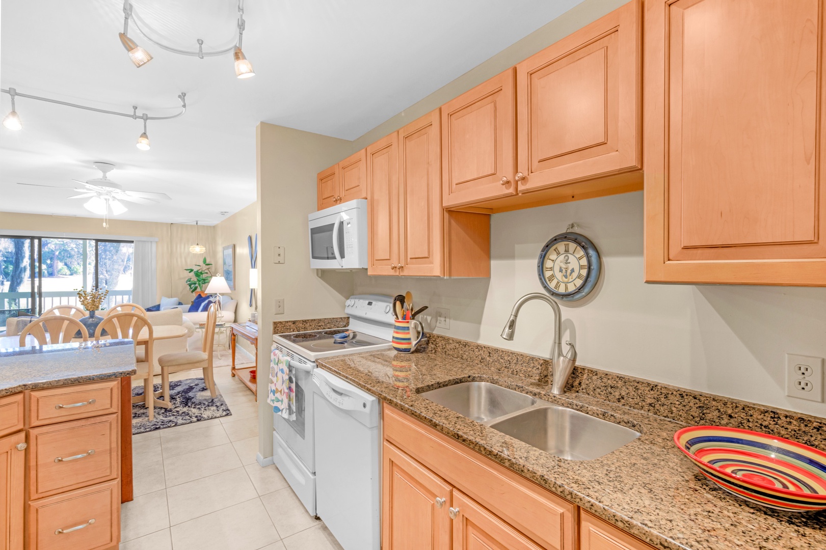 This quaint kitchen offers ample storage space & all the comforts of home