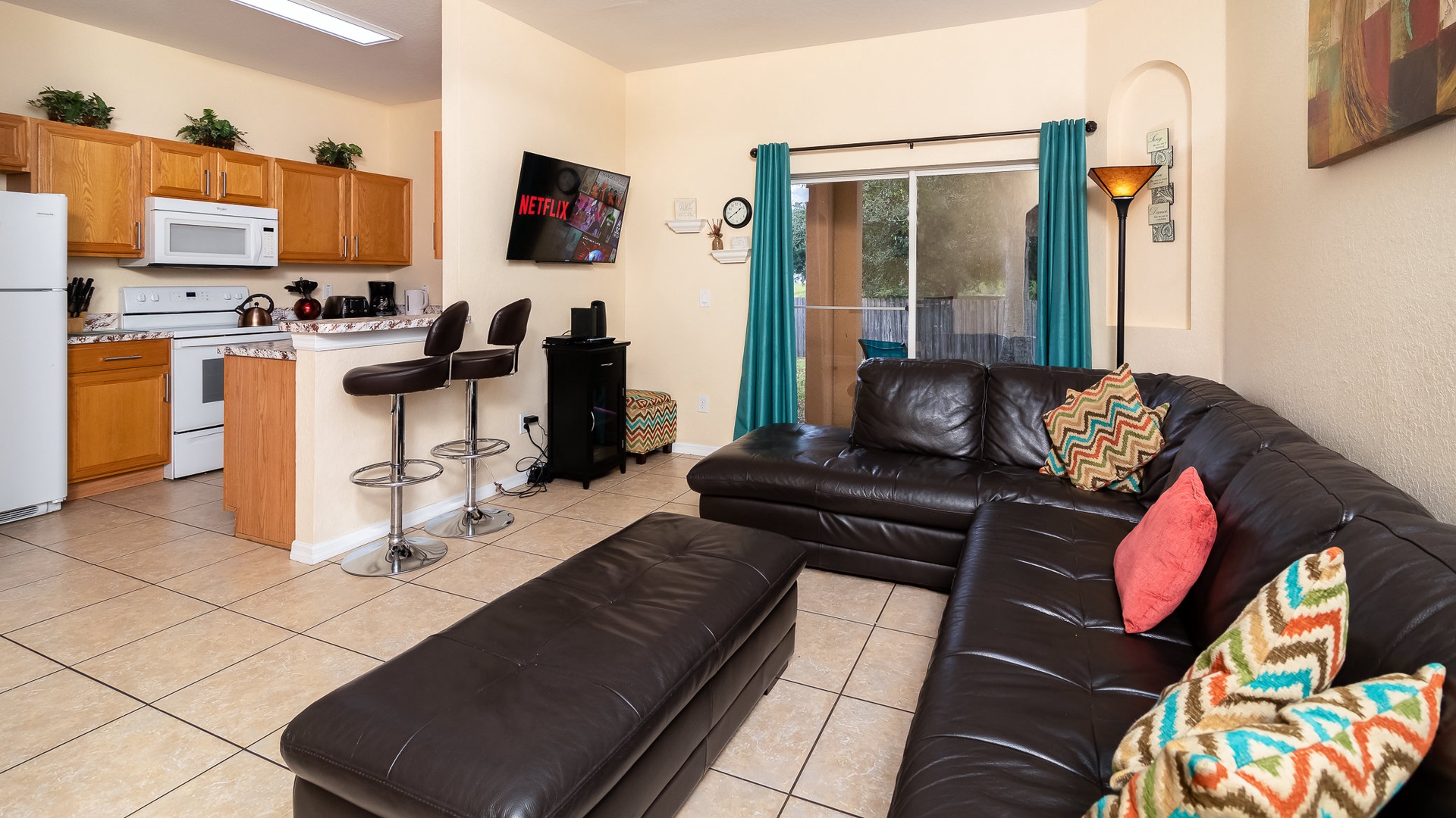 Living area with ample seating. Enjoy your favorite film at night