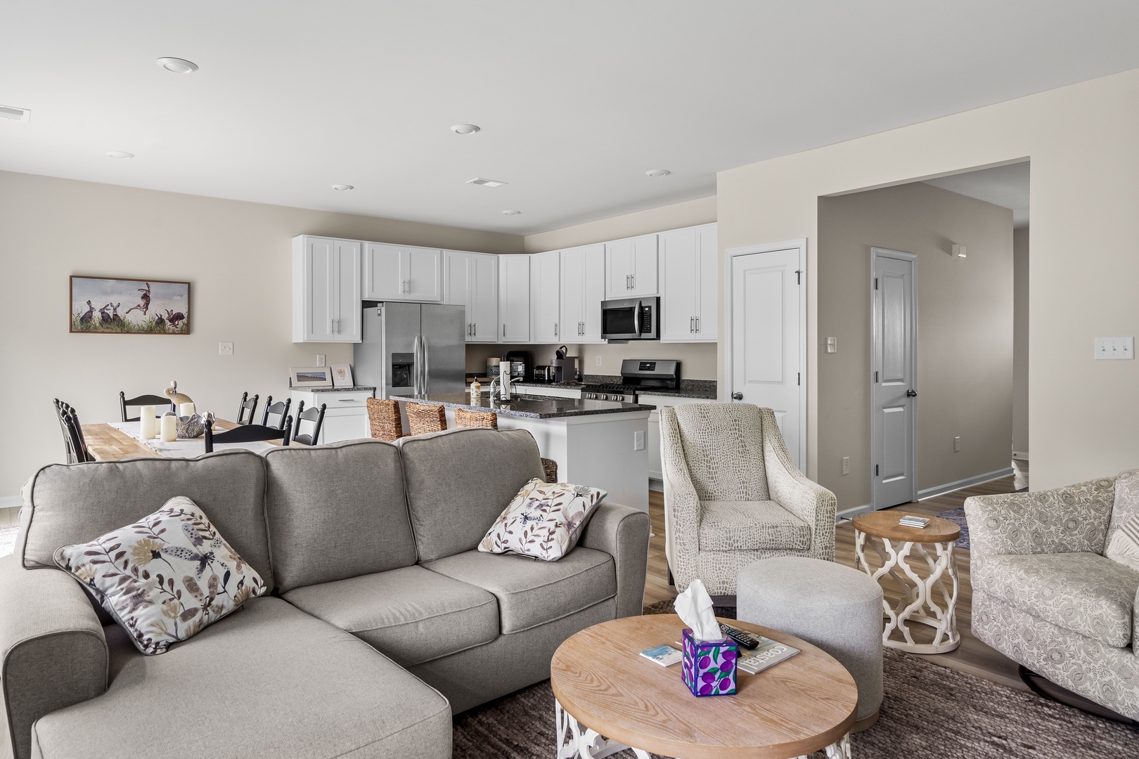 Bright living room with cozy seating, and Smart TV