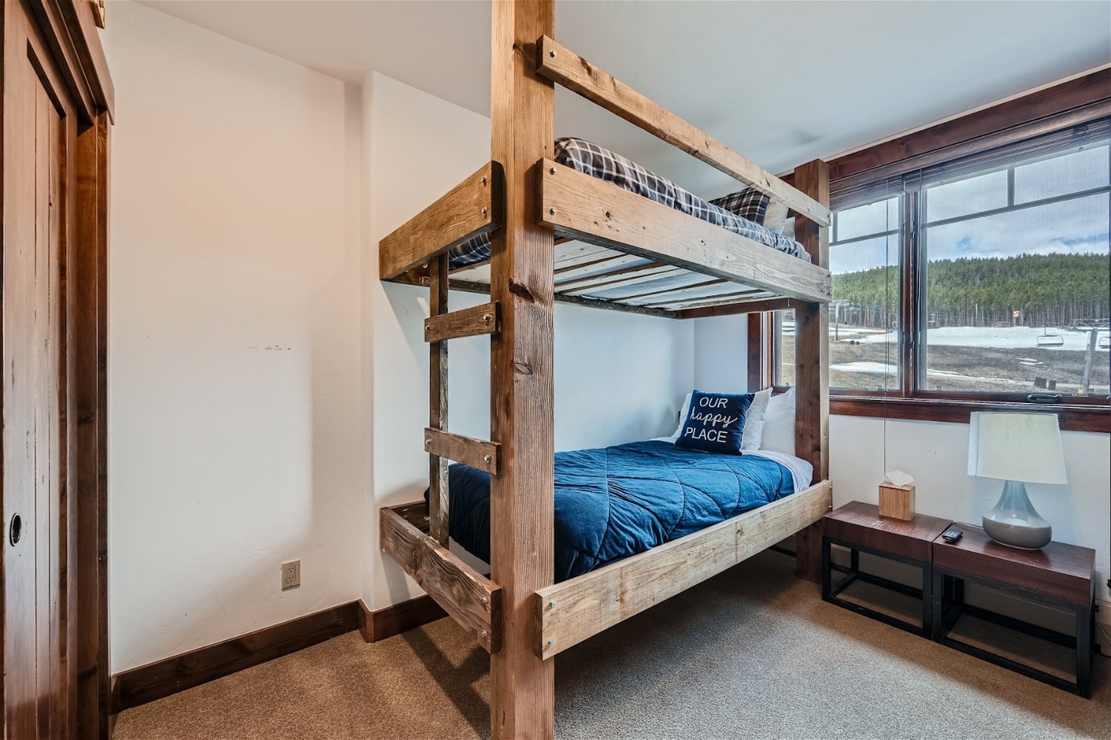 The final bedroom includes a pair of twin-over-twin bunkbeds & Smart TV