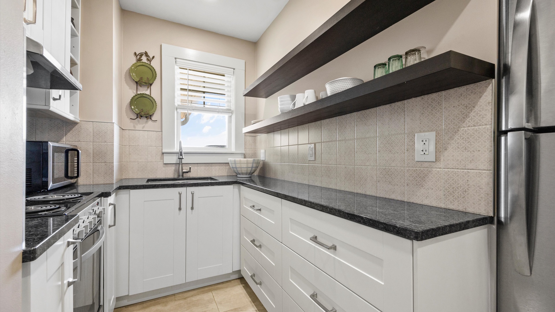 The cozy kitchen offers ample storage space & all the comforts of home