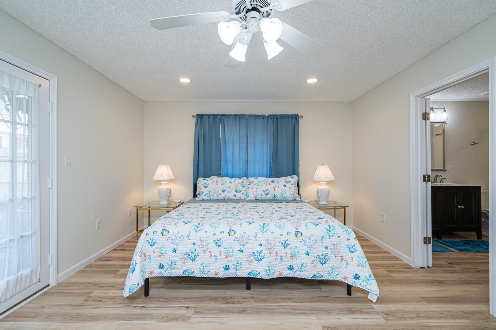 This coastal king suite boasts a private ensuite, smart TV, & patio access