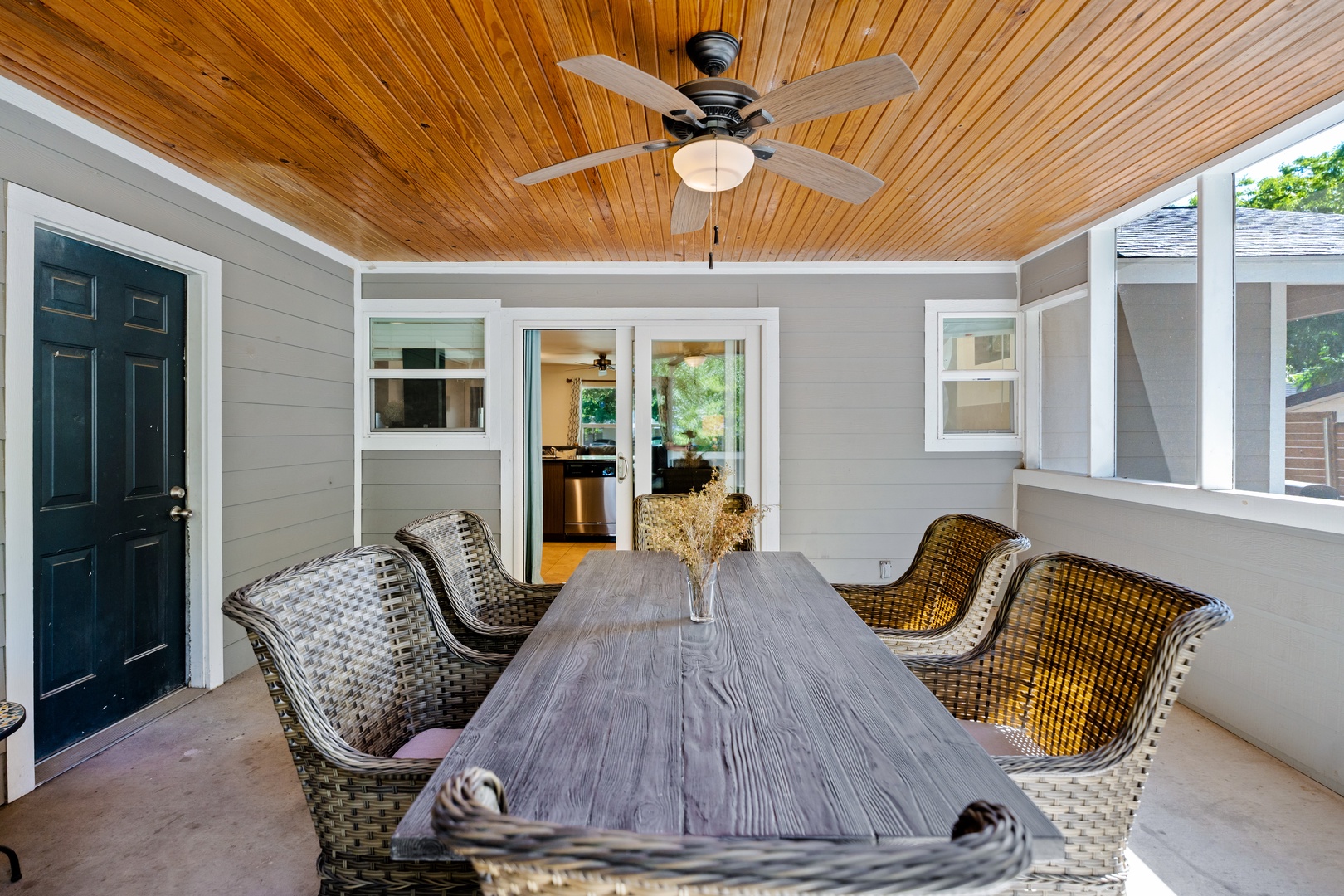 Screened porch with table and seating for 6