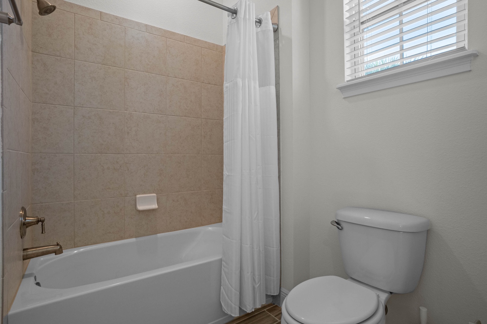 Bathroom 2 with bath tub shower combo en suite to bedroom 2
