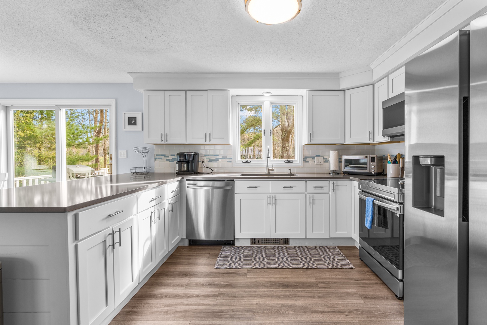 The open, airy kitchen offers ample space & all the comforts of home