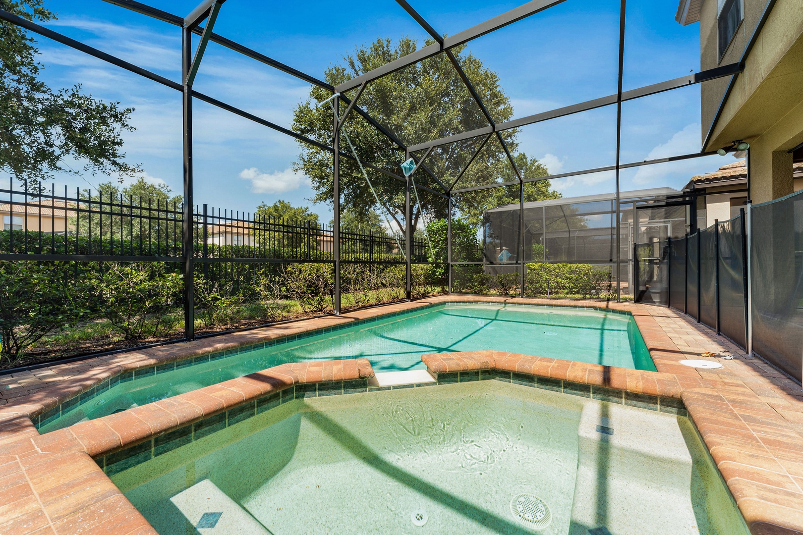 Screened in pool with outdoor seating