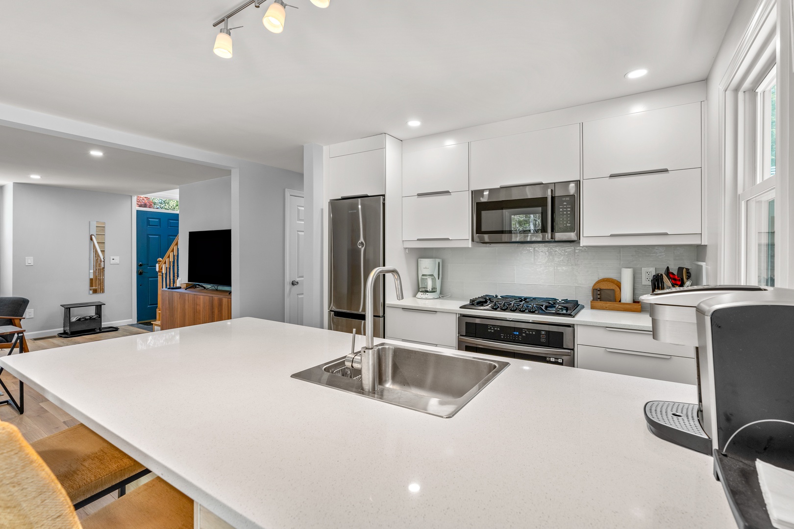 The open, airy kitchen offers ample space & all the comforts of home